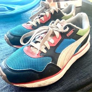 Size 4 Puma multi color block sneaker for kids.